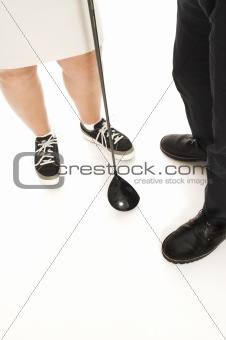 couple with golf club