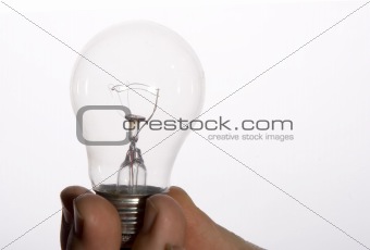 Hand holding Light Bulb on white