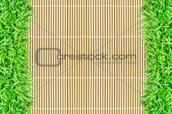 grass frame on bamboo background 