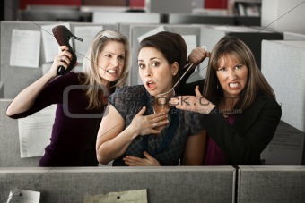 Three Women Quarreling In Office 