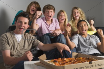 Teenagers Having Fun And Eating Pizza