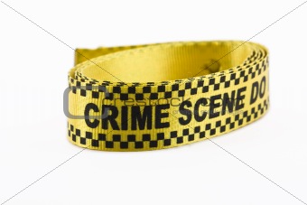 Crime scene banner in a roll, isolated on white