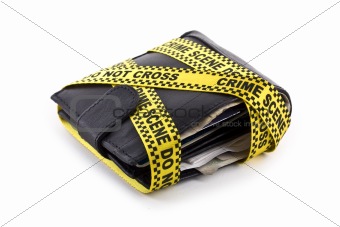 Wallet closed and wrapped in crime scene tape isolated