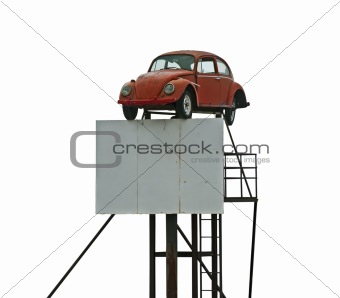 Old car and billboard