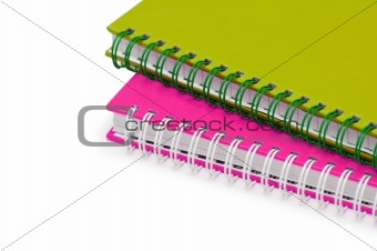 Close up of twol notebooks isolated on white