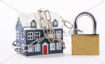 House secured with chain and padlock on white