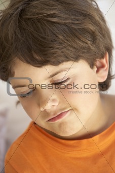 Portrait Of Young Boy Sulking