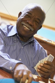 Senior man playing bridge