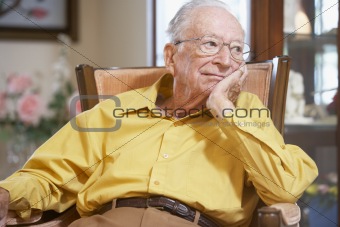 Senior man relaxing in armchair