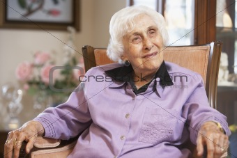 Senior woman relaxing in chair