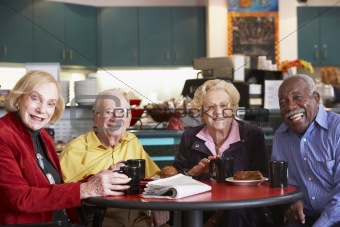 Senior adults having morning tea together