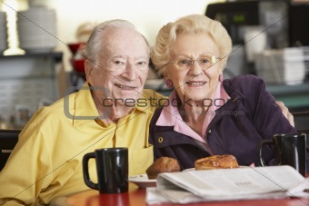 Senior couple having morning tea together