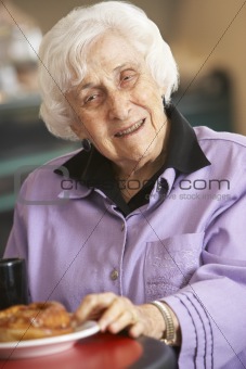 Senior woman having morning tea