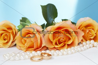  wedding roses with necklace and gold rings