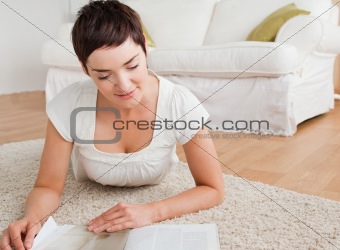 Close up of a brunette reading a magazine