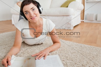 Woman with a magazine enjoying some music