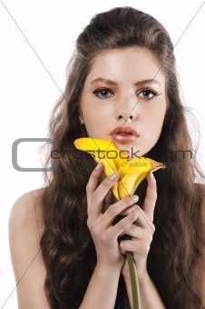 fresh girl posing with a yellow calla