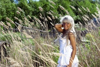 girl are standing in dry grass