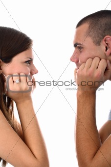 Young couple looking at each other isolated on white
