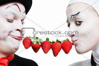 Couple of mims with the strawberry on a white background