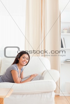 cute woman lying on sofa