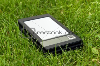 E-Book Reader in the grass