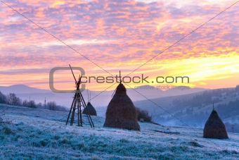 First autumn frosts and sunrise in mountain
