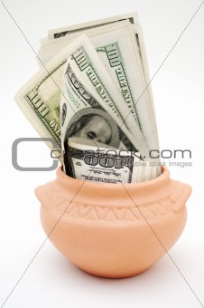 dollars in ceramic pot