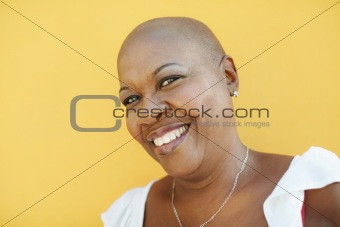 mature african woman smiling at camera