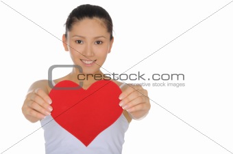 beautiful Asian woman holds out the heart