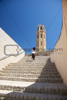 woman upstairs to cathedral at Lleida city