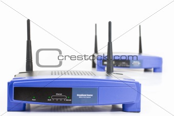 two blue internet router with two antennas