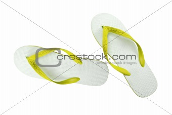 pair of yellow flip-flops isolated on a white background