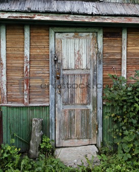 Old door of ramshackle house.