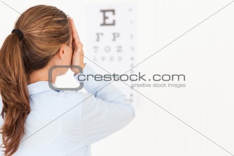 Brunette woman making an eye test 