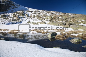 river on snow mountain at Gredos