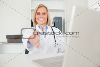 Blonde doctor giving hand