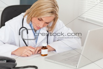 Doctor writing something down