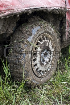 Muddy car tire