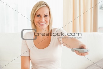 Charming woman watching television
