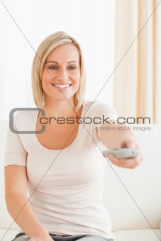 Portrait of a charming woman watching television