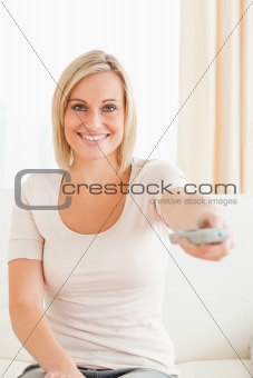 Portrait of a lovely woman watching television