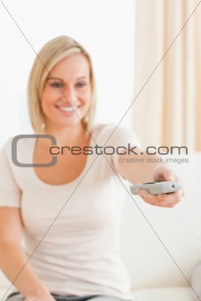Portrait of a cute woman watching television