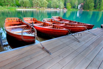 Boats on alpine lake in early morning