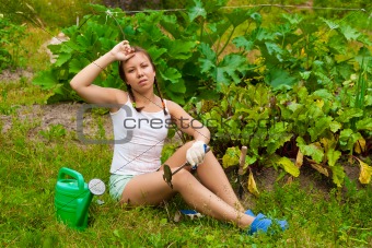 Young woman in kitchen-garden