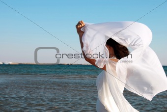 Woman in white at seaside