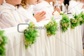 children accepting the first Holy Communion 