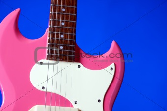 Pink Electric Guitar Isolated on Blue