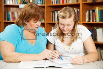 Mother Helps Teen with Homework