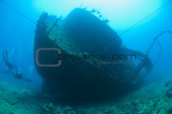 Scuba divers on a large shipwreck